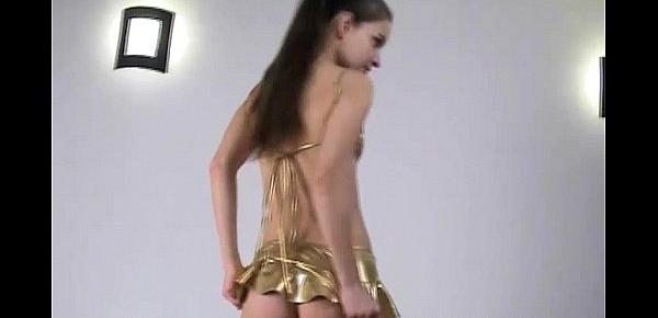  Skinny teen Michaela in shiny gold spandex